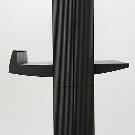 Black furniture with ribbed surface, two horizontal and one vertical plate.