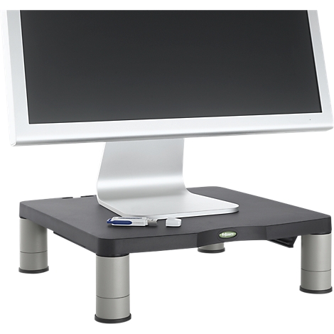 Monitor on black stand with USB stick. Silver frame, display black. Stand with silver legs.