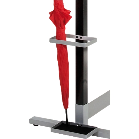 Red umbrella in a grey stand. The stand has a rectangular shape with a black post.