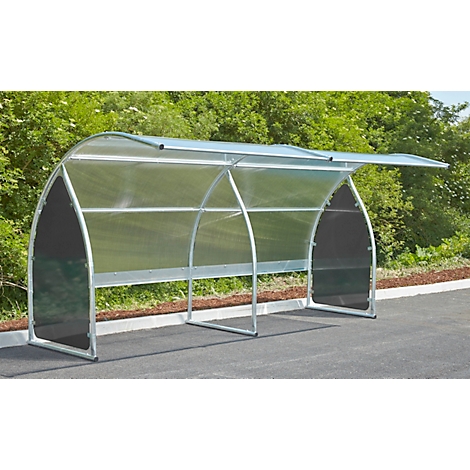 A transparent bus stop shelter with metal frame. The stop offers protection from rain.