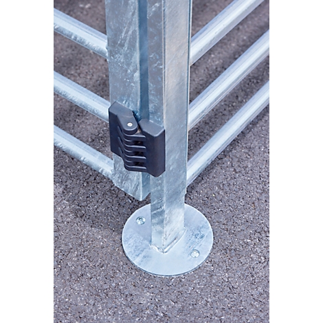 Metal gate with a black locking mechanism, close-up shot.