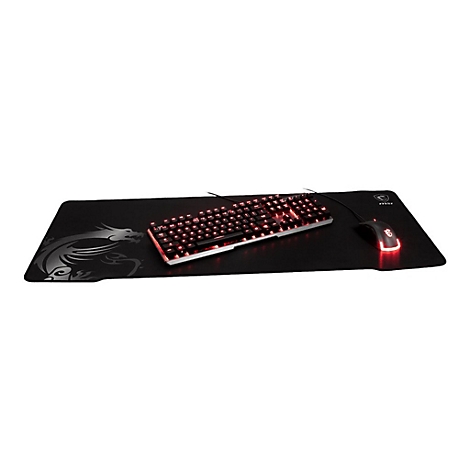 MSI Gaming Tastatur und Maus auf einem großen Mauspad mit Drachen-Logo vor weißem Hintergrund.