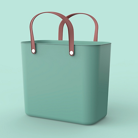 Turquoise shopping bag with brown handles in front of a turquoise background.