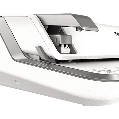 Close-up of a white and gray stapler. The stapler is partially open, revealing the mechanism.