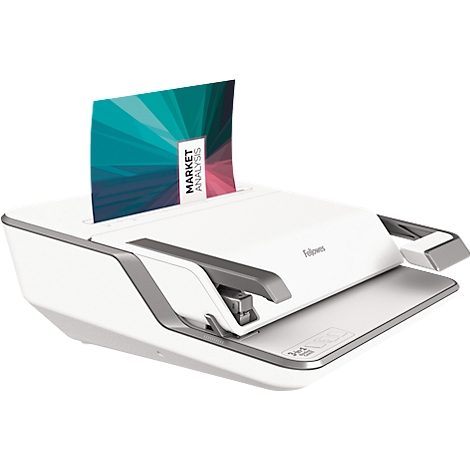 A white binding machine with a colorful document labeled 'MARKET ANALYSIS'.