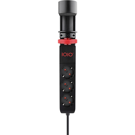 Un appareil électronique noir avec un anneau rouge et trois éléments ronds éclairés.