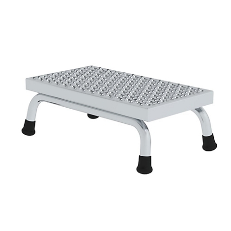 Trittschemel aus Metall mit geriffelter Trittfläche, an vier schwarzen Füßen stehend.