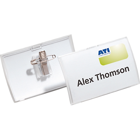 Name tags, one opened with safety pin, the other with the name Alex Thomson and the ATI International logo.