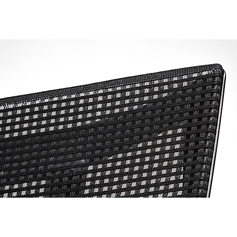 Close-up of a corner of black, square patterned fabric against a white background. The fabric is highly textured.