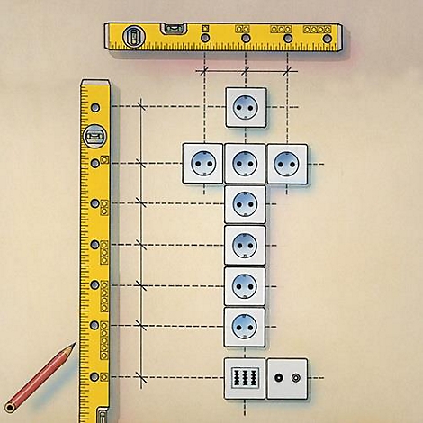 Dessin d'une installation de prises électriques avec un niveau à bulle, un crayon et des mesures.