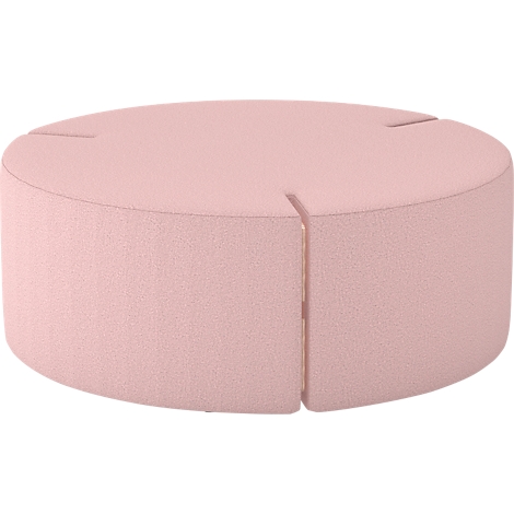 Ein rosafarbener, runder Hocker mit einem Spalt. Der Hocker hat eine textile Oberfläche.