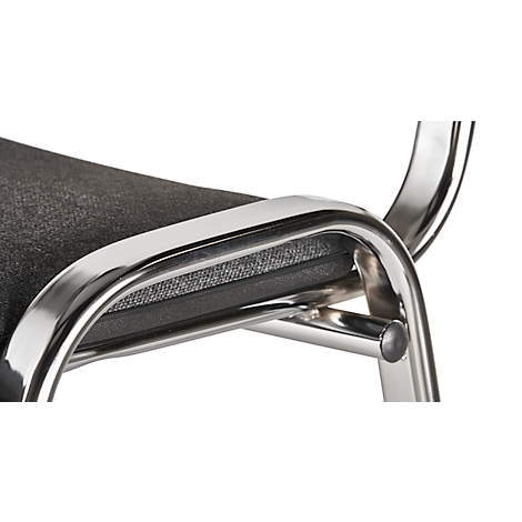 Close-up of a chair. The frame is shiny metal, the seat is gray-black, padded.