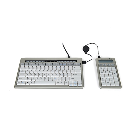 Grey keyboard with separate number pad, connected by cables, on a white background.