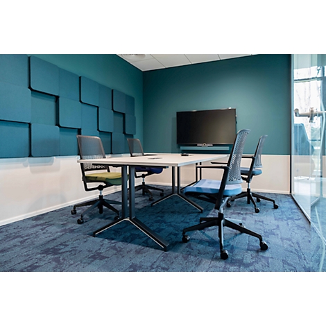 Conference room with table, chairs and screen. Blue wall paneling, blue carpet.