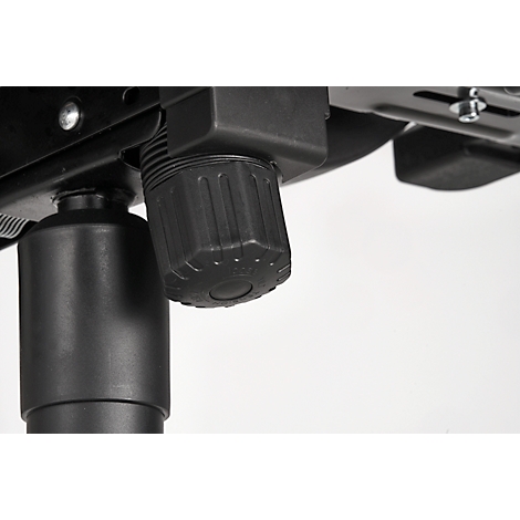 Detail: Black, ribbed adjustment knob under a metallic chair frame, set against a bright background.