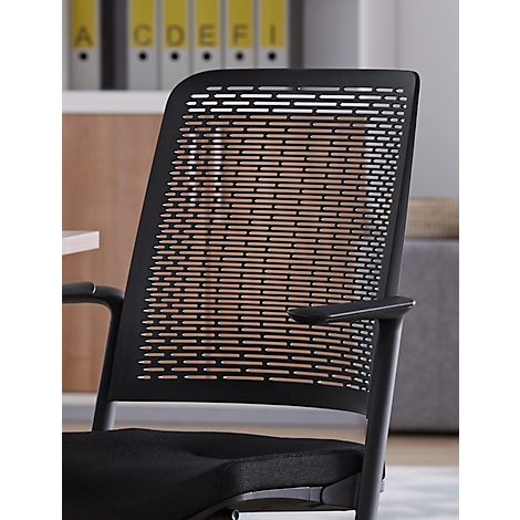 Black office chair with perforated backrest. Folders are visible behind.