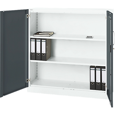 Open steel cabinet, white interior, gray doors. Binders, notebook, and code device on shelves.