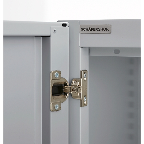 Close-up of a cabinet showing the hinge and the 'SCHÄFERSHOP' logo.
