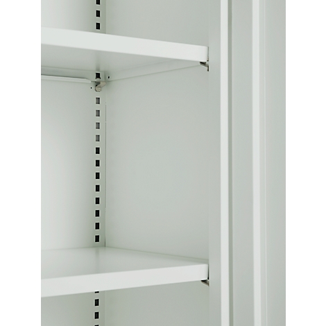 Close-up of a light gray cabinet interior with two shelves. The cabinet wall can be seen between the shelves.