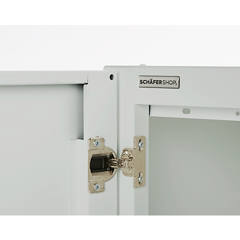 Cabinet door detail: White painted door with silver hinge and "SCHÄFERSHOP" logo.