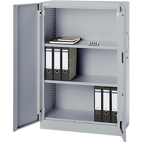 Gray steel cabinet with open door. Folders, notebook and a calculator lie on the shelves.