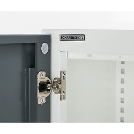 Close-up of a cabinet with hinge, open door, and the inscription SCHÄFERSHOP.