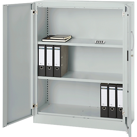 Gray file cabinet, open door. Folders and notebooks inside.