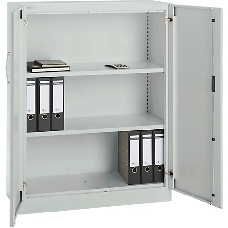 Grey filing cabinet with open door. File folders, notebooks and a calculator are in the cabinet.