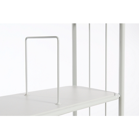 Detail of a white bookcase with a vertical bookend. Bright background.