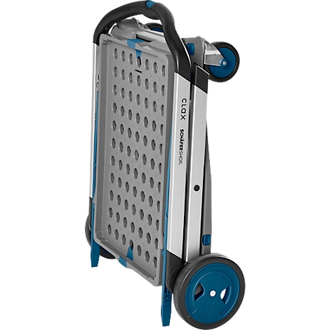 Chariot de courses gris plié avec roues et poignée bleues. "CLOX", "Shopper" écrit sur le côté.