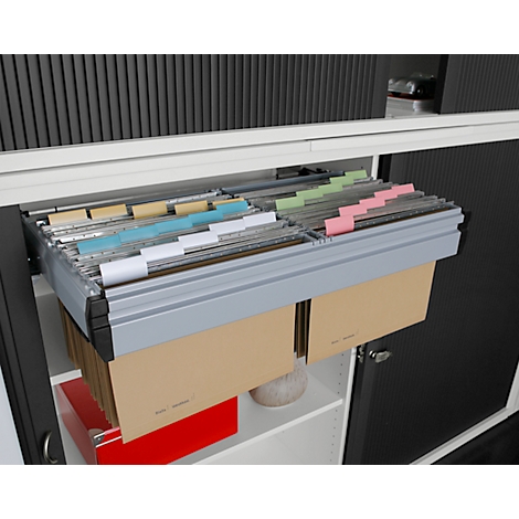 Open file cabinet with colored index cards, beige and red folders in the lower part. Gray cabinet doors.