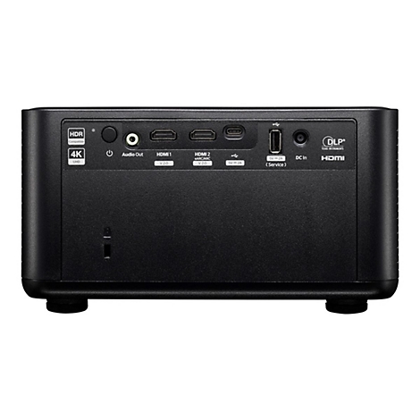 Schwarzer Projektor, Rückseite mit Anschlüssen: Audio, HDMI, USB, Stromversorgung, und Logo.