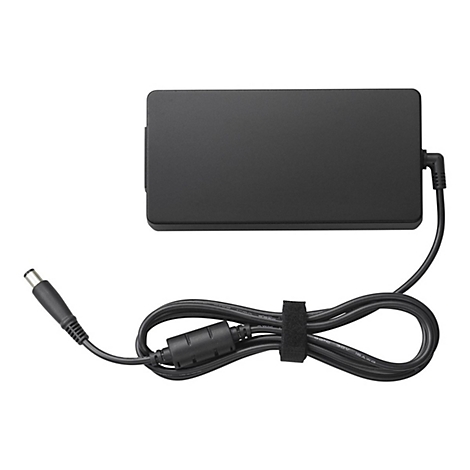 Adaptateur secteur pour ordinateur portable noir avec câble. Boîtier rectangulaire avec câble connecté, bouclé et fixé avec du velcro. Prise à gauche.