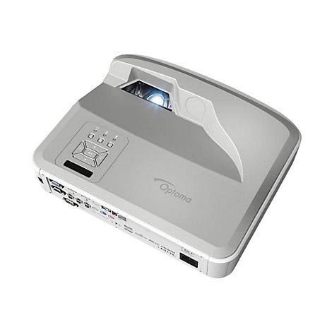 Hellgrauer Optoma-Projektor, Draufsicht. Auf der Oberseite befinden sich Bedienelemente. Die Linse leuchtet.