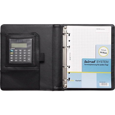 Bloc-notes noir avec calculatrice et papier quadrillé. L'intérieur montre une feuille quadrillée avec l'inscription "bind SYSTEM" et "Terminplanung für jeden Tag!"