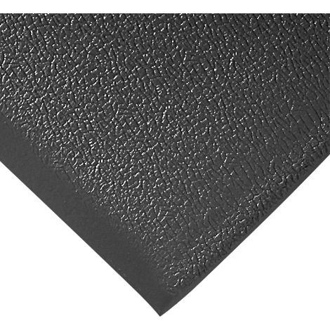 A gray, textured material, possibly a mat, at an angle against a white background.