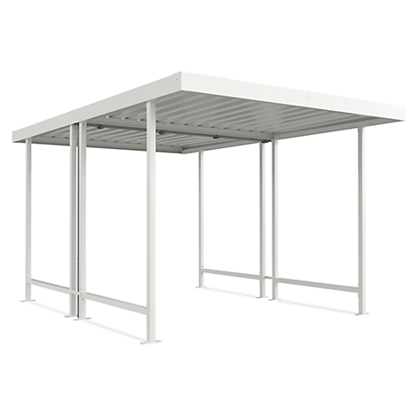 White, modern bicycle shelter. The roof is corrugated, supported by four metal supports. The structure stands on a white surface.