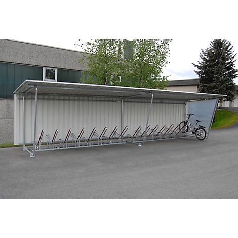 Bike shelter with bikes. One bike is ready for parking.