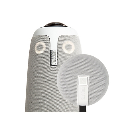 Haut-parleur gris avec des accents blancs et une lentille ronde sur le dessus. Un détail rond plus petit avec un logo est à côté.