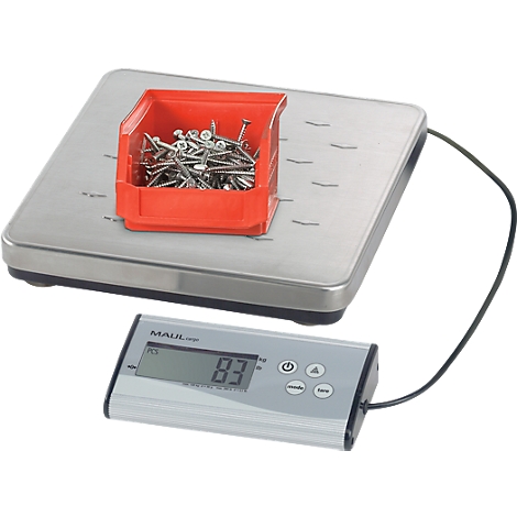 Scale with a red box full of screws. The scale displays 83.