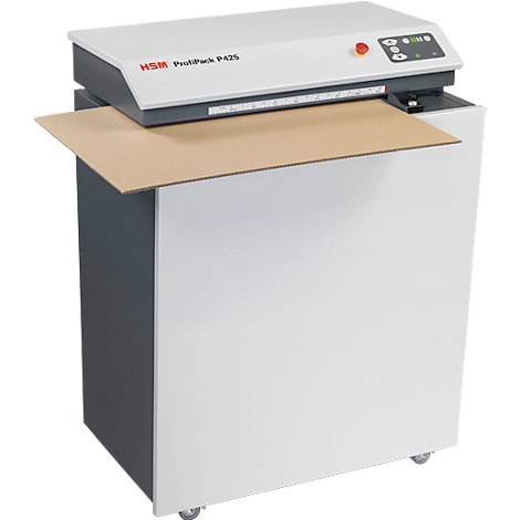 A white cardboard compactor with a gray top, brown cardboard, and rollers.