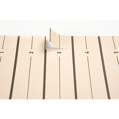 Detail of a beige paper sheet with black lines and numbers. At number 3, a part is torn off and folded up.