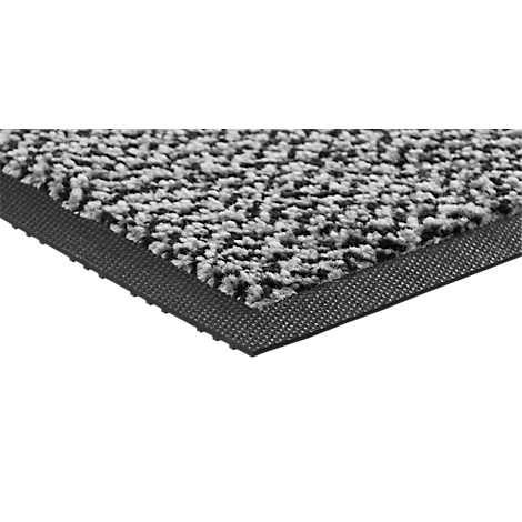 Gros plan d'un paillasson gris avec une bordure en caoutchouc noir.