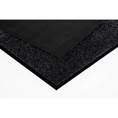 Tapis multicouche avec une surface supérieure noire lisse et une texture foncée rugueuse sur les côtés.