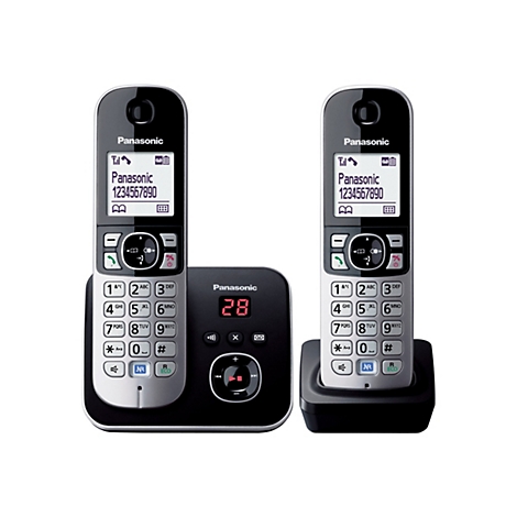 Zwei silber-schwarze Panasonic DECT-Telefone mit Basisstation vor weißem Hintergrund.