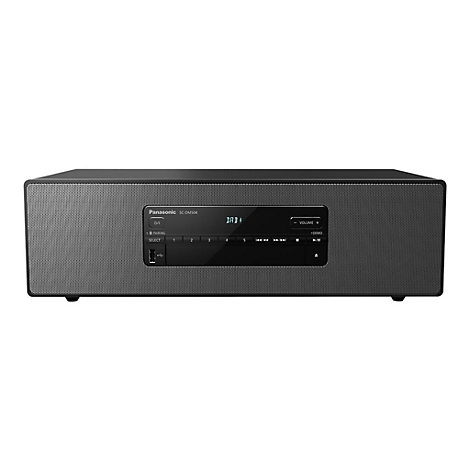 Système audio Panasonic noir. Un écran et des commandes se trouvent sur le panneau avant. Le haut-parleur présente un motif de trous.