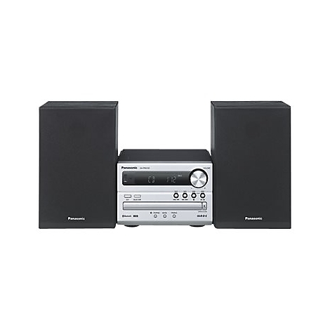 Kompakte Stereoanlage mit zwei Lautsprechern und zentralem Bedienelement, silberfarbenes Gehäuse. Auf dem Display: CD und Uhrzeit.