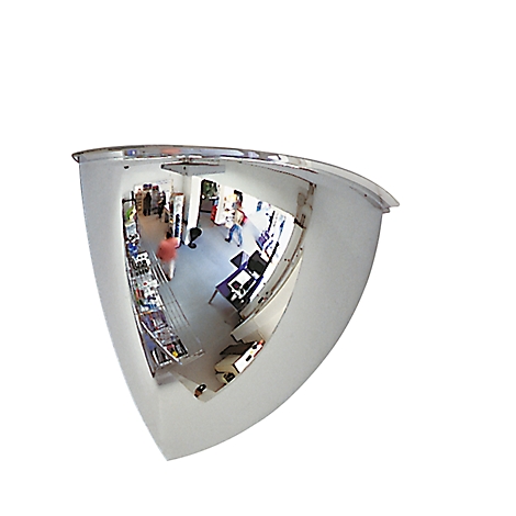 A hemispherical mirror reflects a room where people are walking around.
