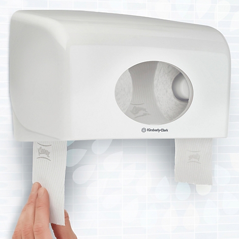 Dispensador de toallas de papel blanco. Un brazo saca una toalla. Con el logotipo de Kimberly-Clark.