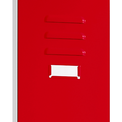 Close-up of red metal surface with three horizontal ventilation slots and a rectangular white label holder.